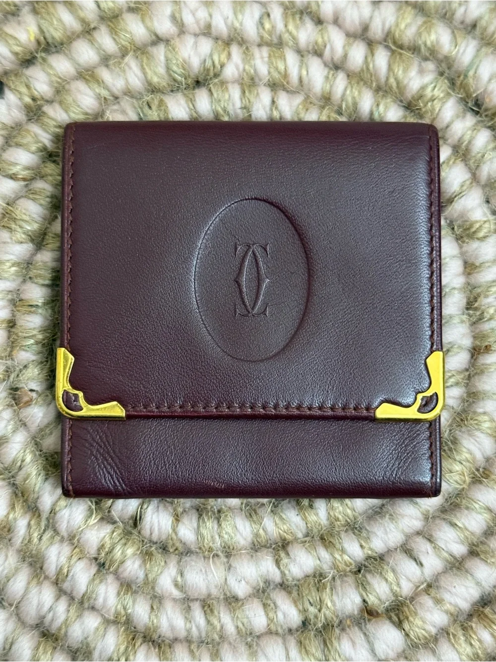 Cartier Deep Burgundy Leather Compact Wallet with Gold Accents